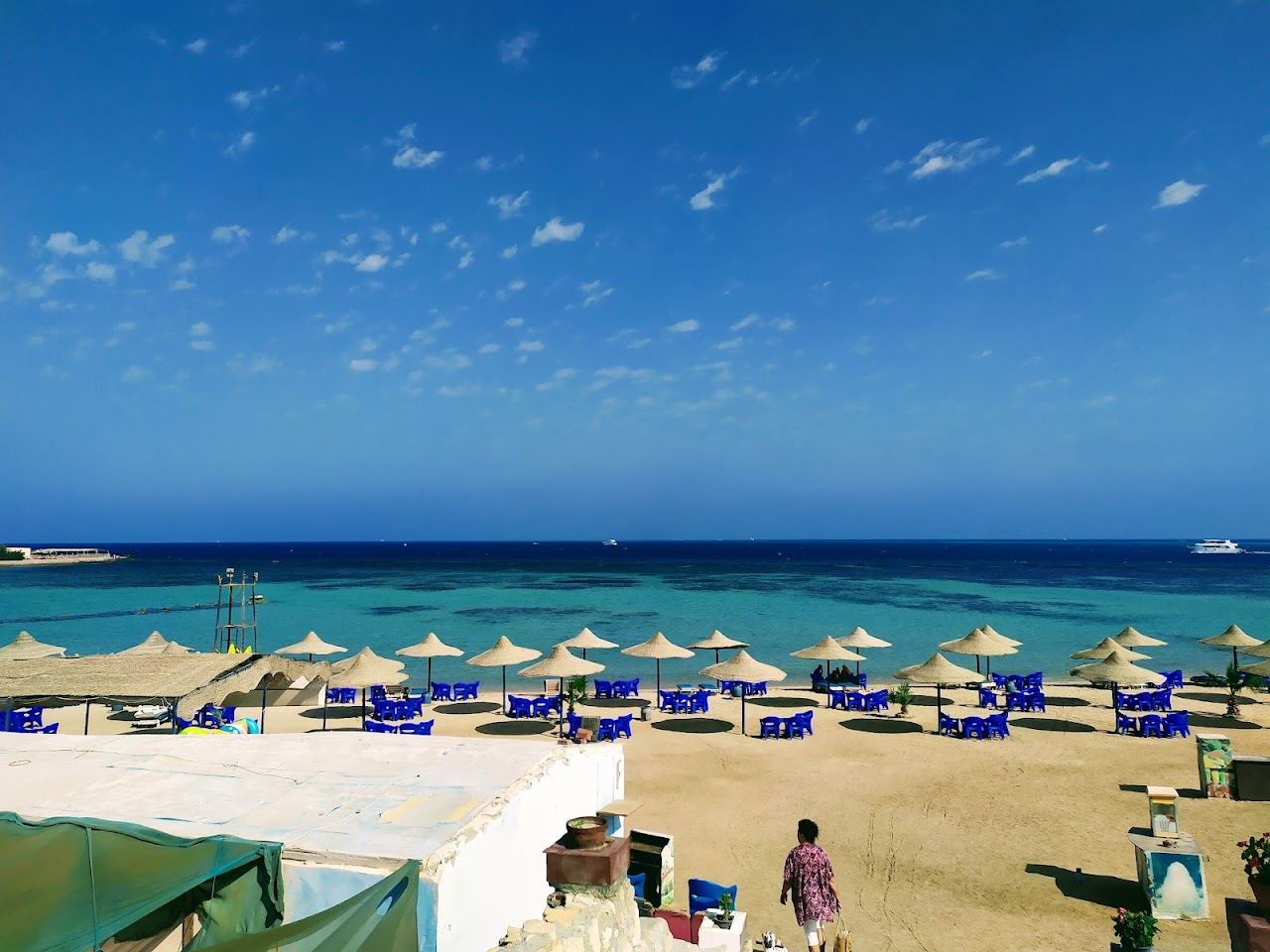 The sandy public beach and calm water of El Sawaky in the Dahar old town district of Hurghada on the Red Sea in Egypt