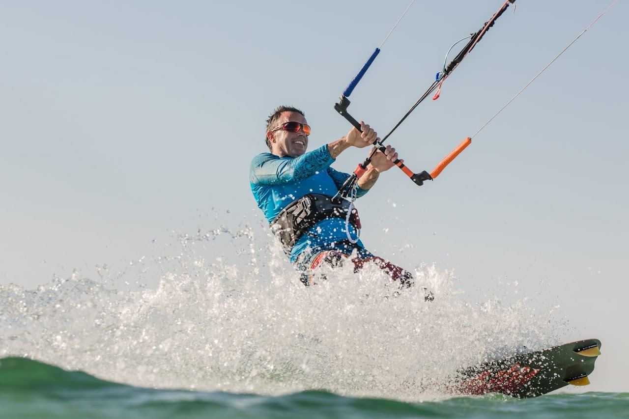Kites and boards on the shallow lagoon at Magawish beach near Hurghada with the open Red Sea beyond