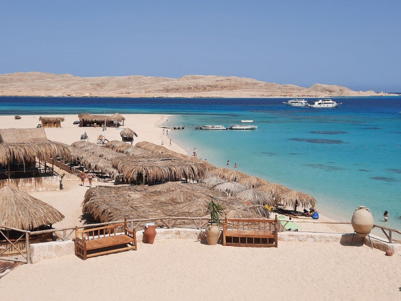 The white sand and shallow turquoise water of the managed beach club at Mahmya on Giftun Island near Hurghada in Egypt
