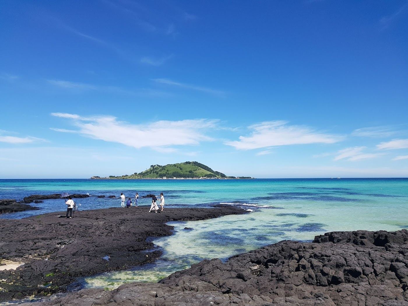 White shell sand and shallow emerald water at Hyeopjae Beach on the west coast of Jeju Island