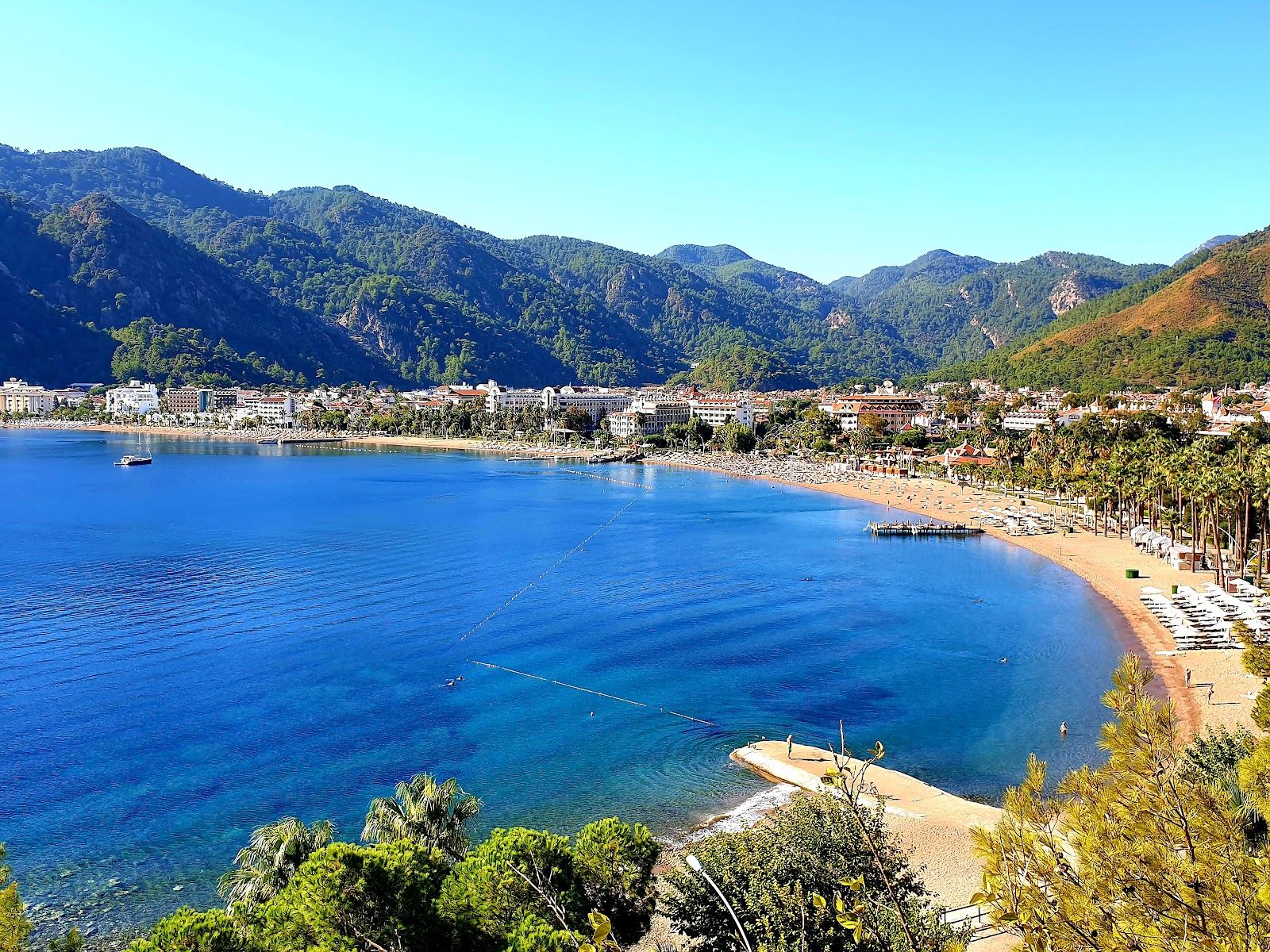 Icmeler beach and bay southwest of Marmaris backed by pine mountains in Turkey