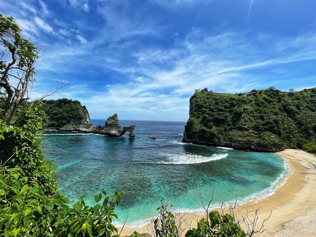 The sheltered cove and rock arch of Atuh Beach, Nusa Penida