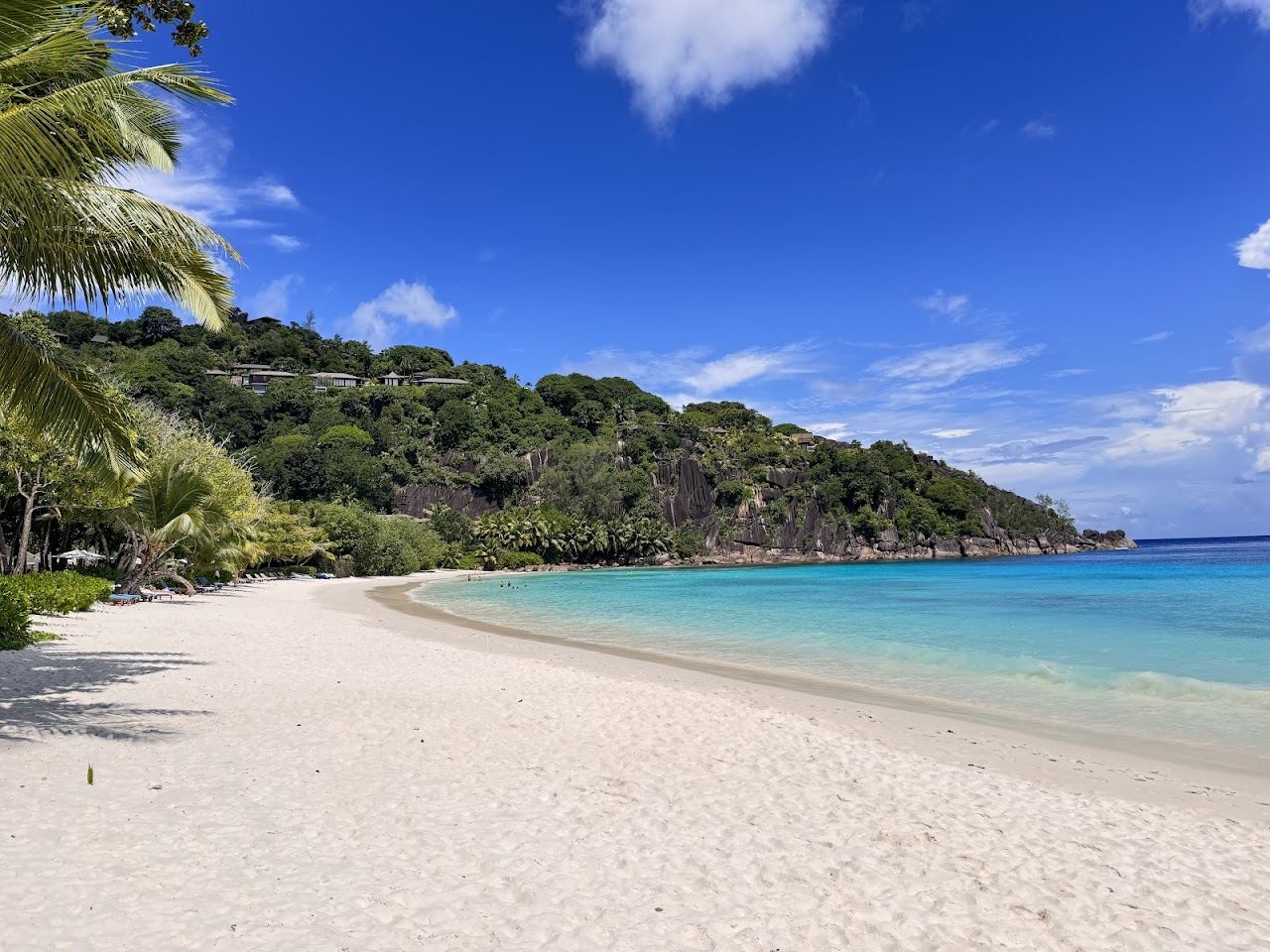 The sheltered calm bay of Petite Anse inside the Four Seasons grounds on south Mahe