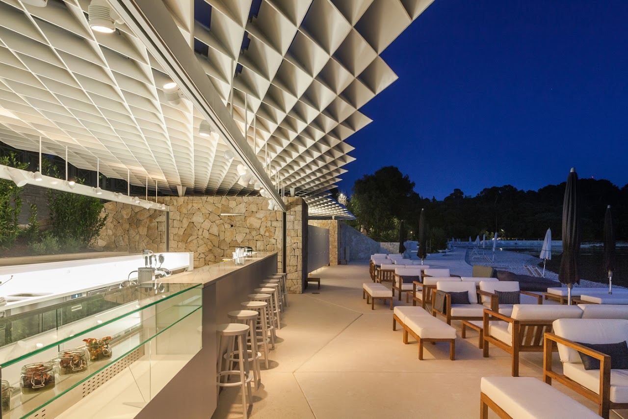 Loungers and clear Adriatic water at the Mulini beach bar beside Rovinj in Istria