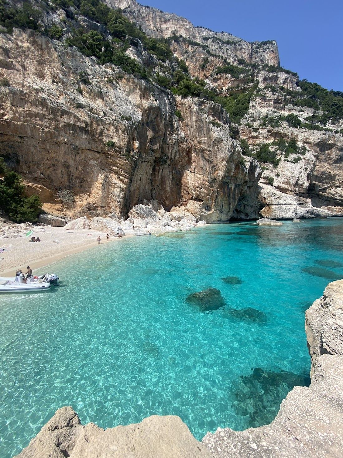 Cala Mariolu in Gulf of Orosei, Sardinia with clear water and sand
