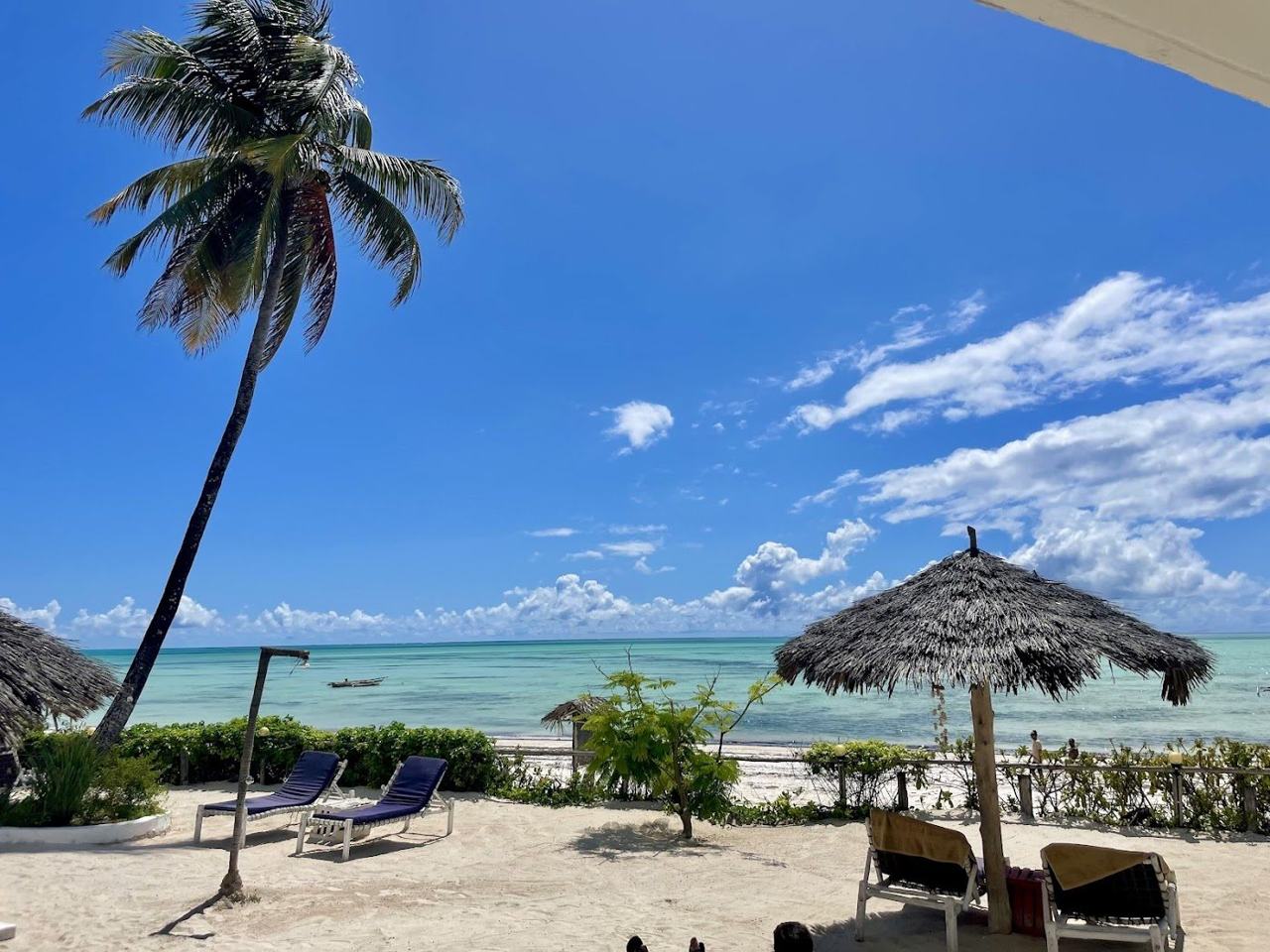 A second view of the wide shallow lagoon and fishing boats at Jambiani beach on Zanzibar
