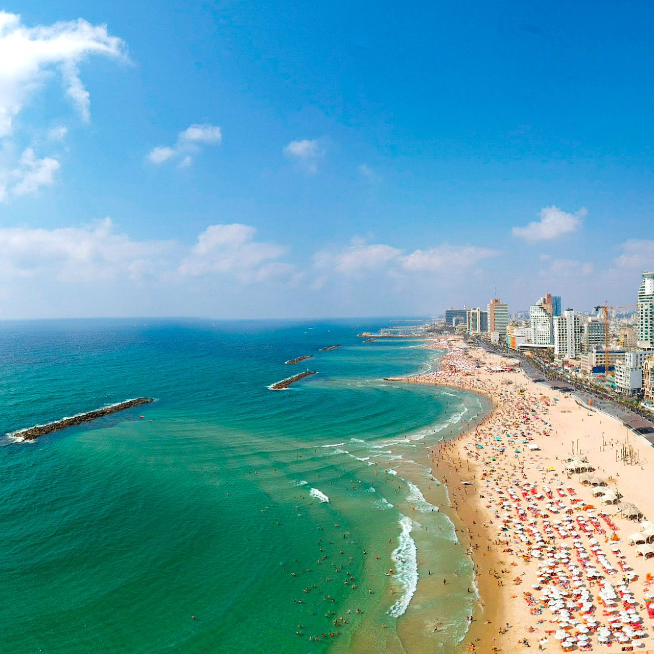 The soft sand and promenade of Jerusalem beach in central Tel Aviv on the Mediterranean