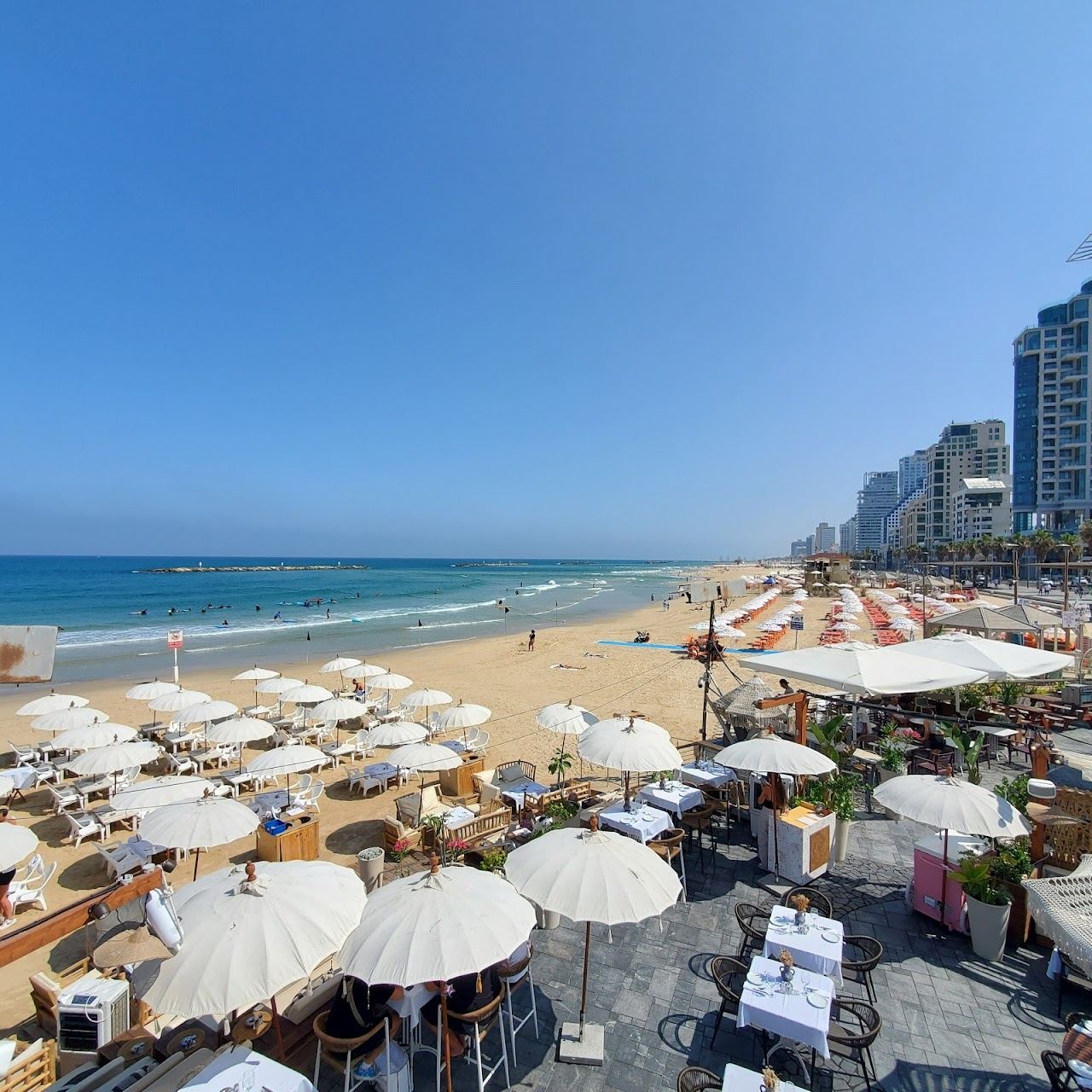 The promenade, sunbeds and soft sand of Jerusalem beach in central Tel Aviv