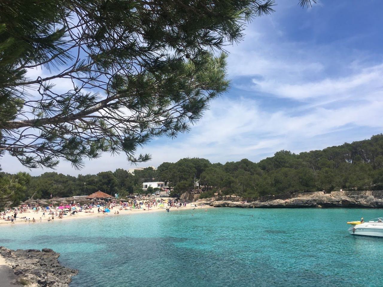 Turquoise calas, warm sea and reliable sun, with July busy but still easy and family friendly.