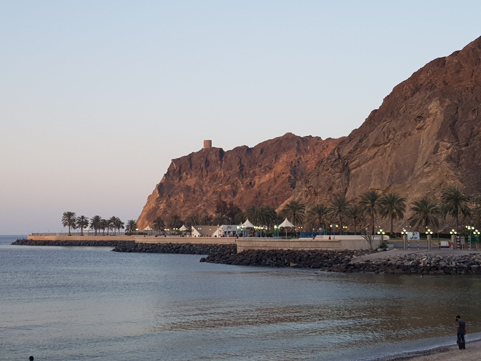 Calm waterfront bay and park beside the Muttrah corniche at Kalbuh Bay in Muscat, Oman