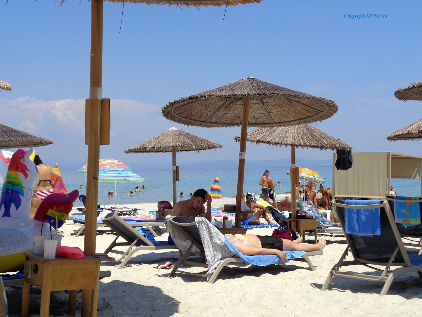 Sunbeds and clear water on the organised beach at Kallithea on Kassandra in Halkidiki