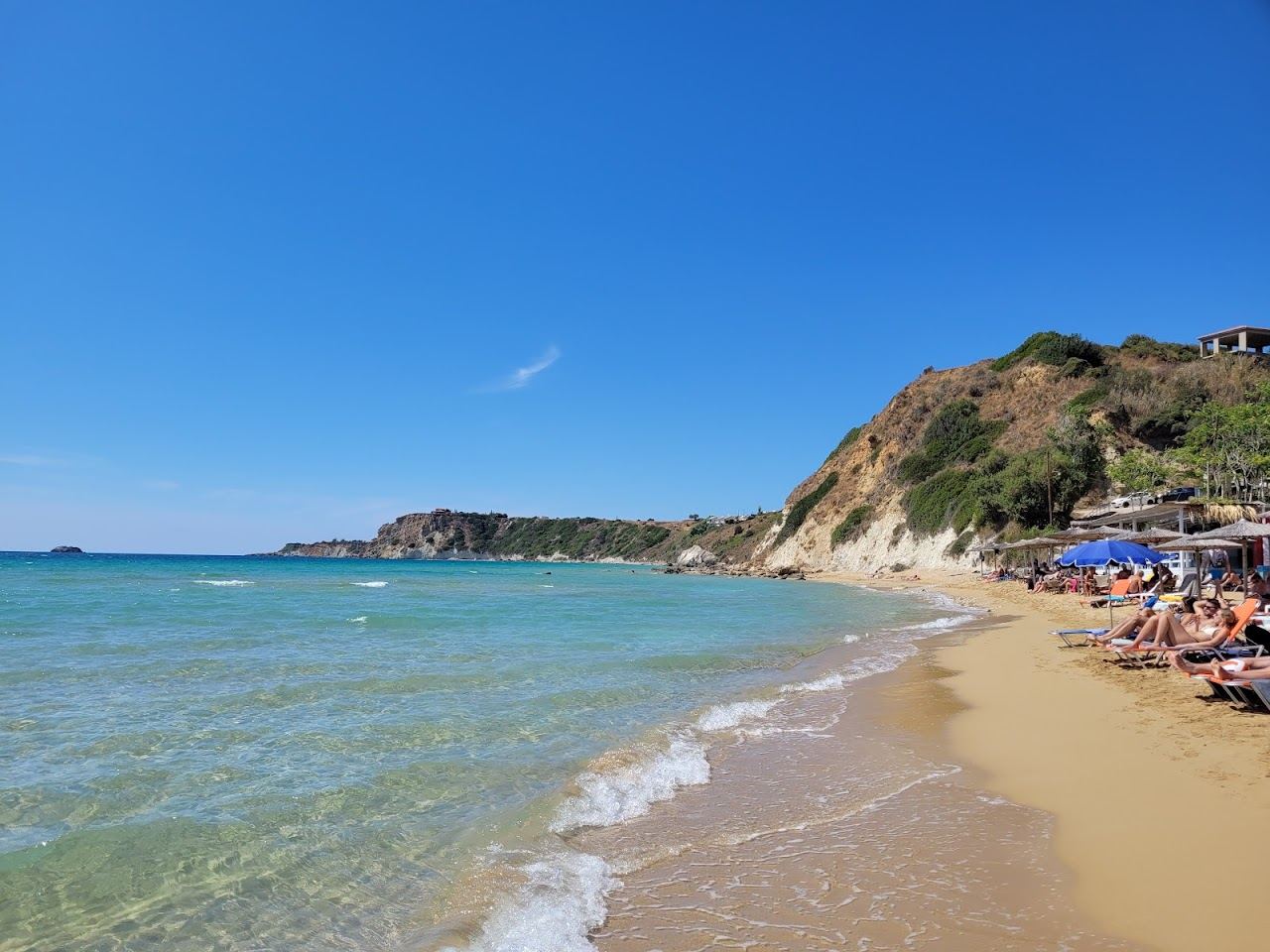 The wide reddish gold sand and open sea of Avithos Beach near Spartia in south Kefalonia