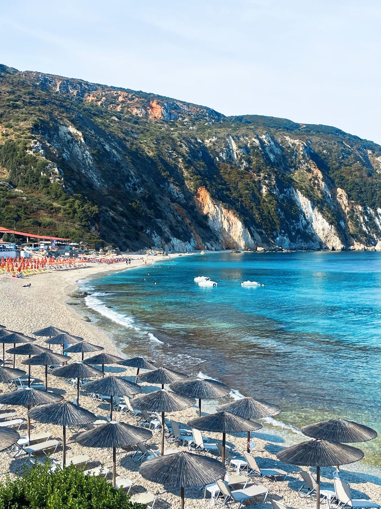 The white pebbles and deep blue sunset water of Petani Beach on the Paliki peninsula of Kefalonia