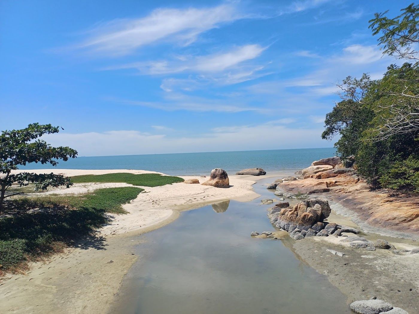 The forest, headland and cove at Kerachut Beach in Penang National Park