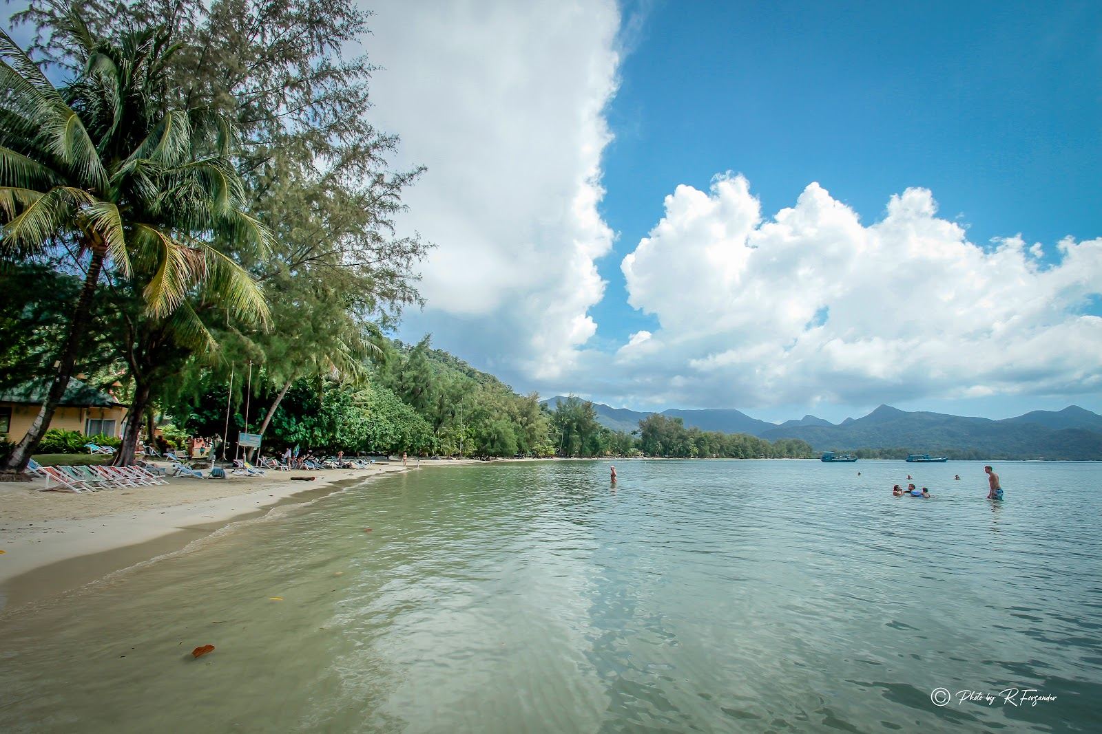 Long quiet stretch of sand and palms at Klong Prao Beach on Koh Chang