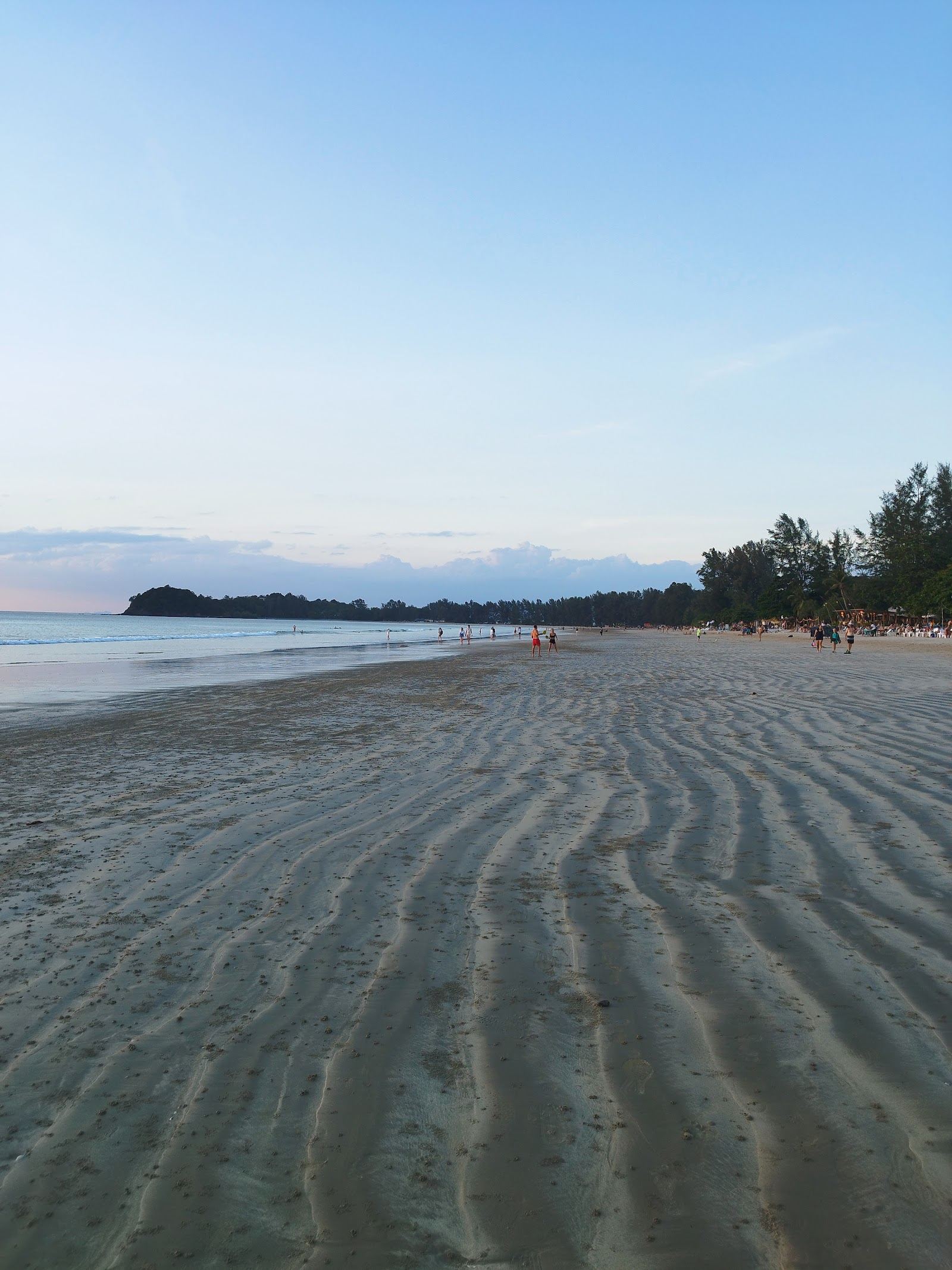 Calm shallow water and soft sand along the west coast of Koh Lanta at Klong Dao