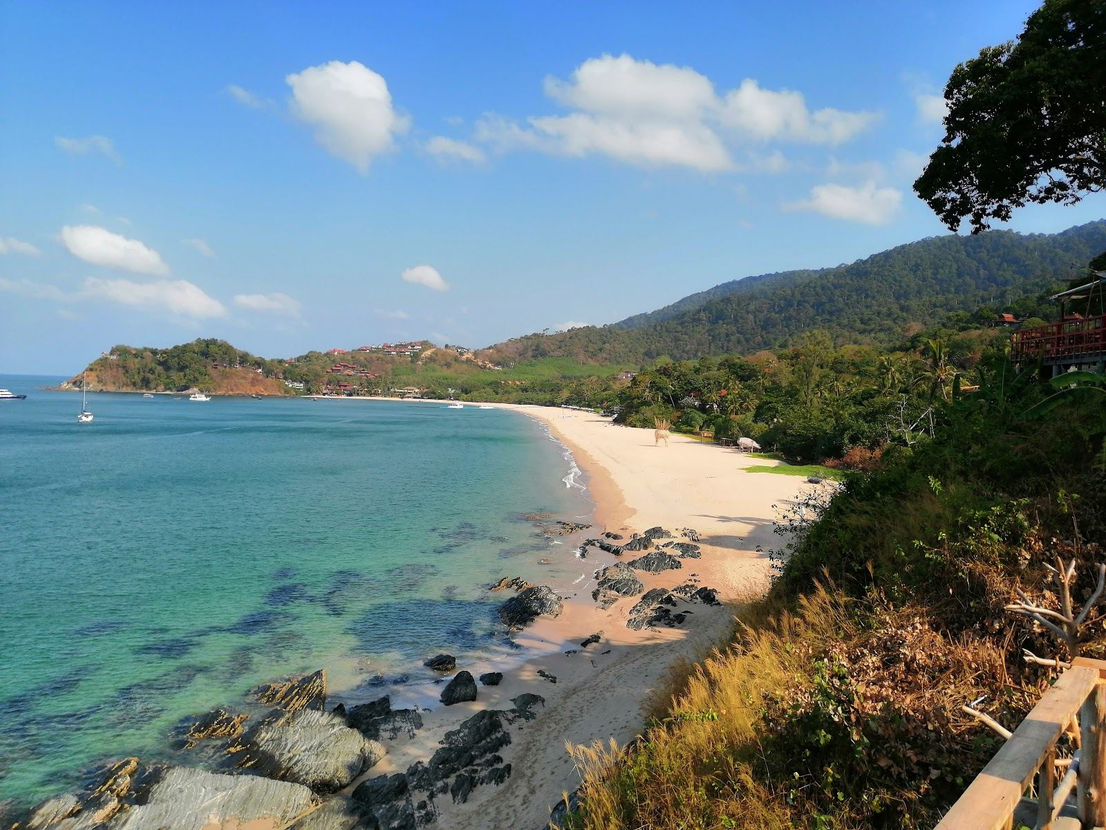 Jungle backed curve of sand and calm Andaman water at Kantiang Bay in the south of Koh Lanta