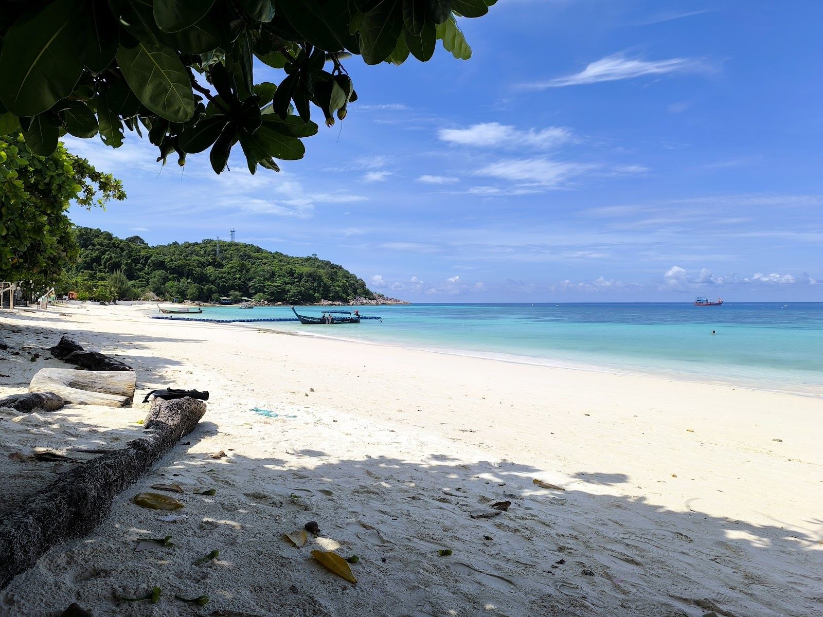 Clear, still water over pale sand on Pattaya Beach in the middle of Koh Lipe
