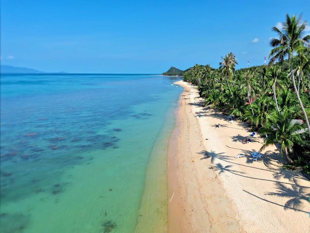 Quiet sand and calm water at Bang Por Beach on Koh Samui