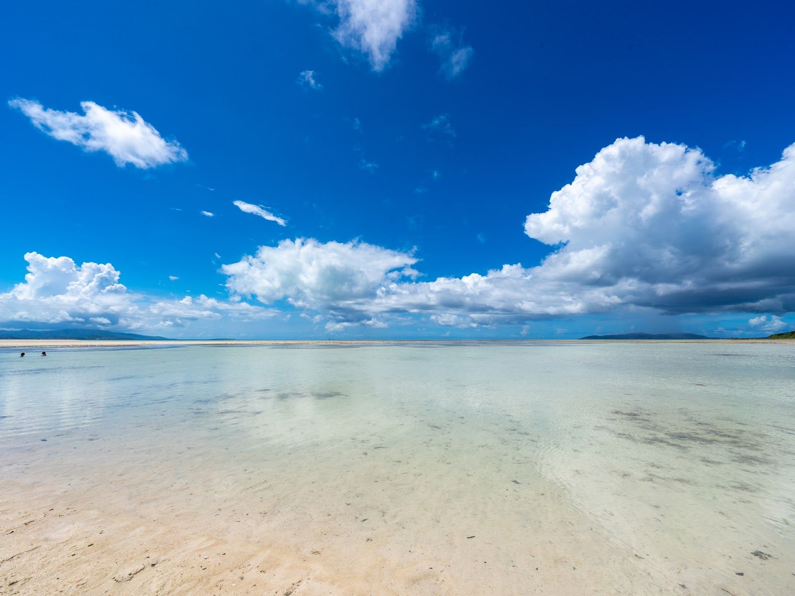 Shallow clear water and rippled sandbar at Kondoi Beach on Taketomi, Okinawa