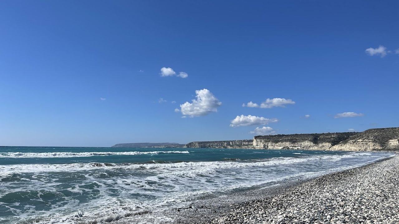 Wide bay of sand and shingle beneath the cliffs of the ancient Kourion site near Limassol in Cyprus