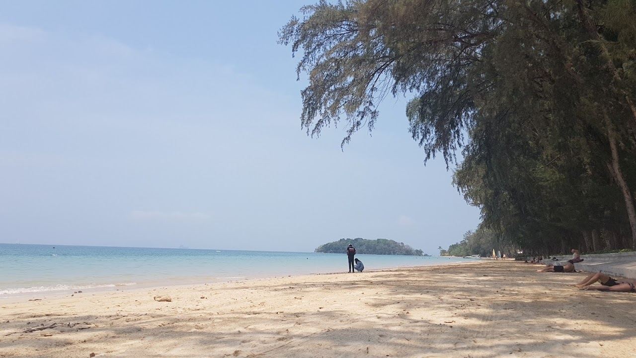 Calm shallow water and pale sand at the quiet Klong Muang bay on the Krabi coast