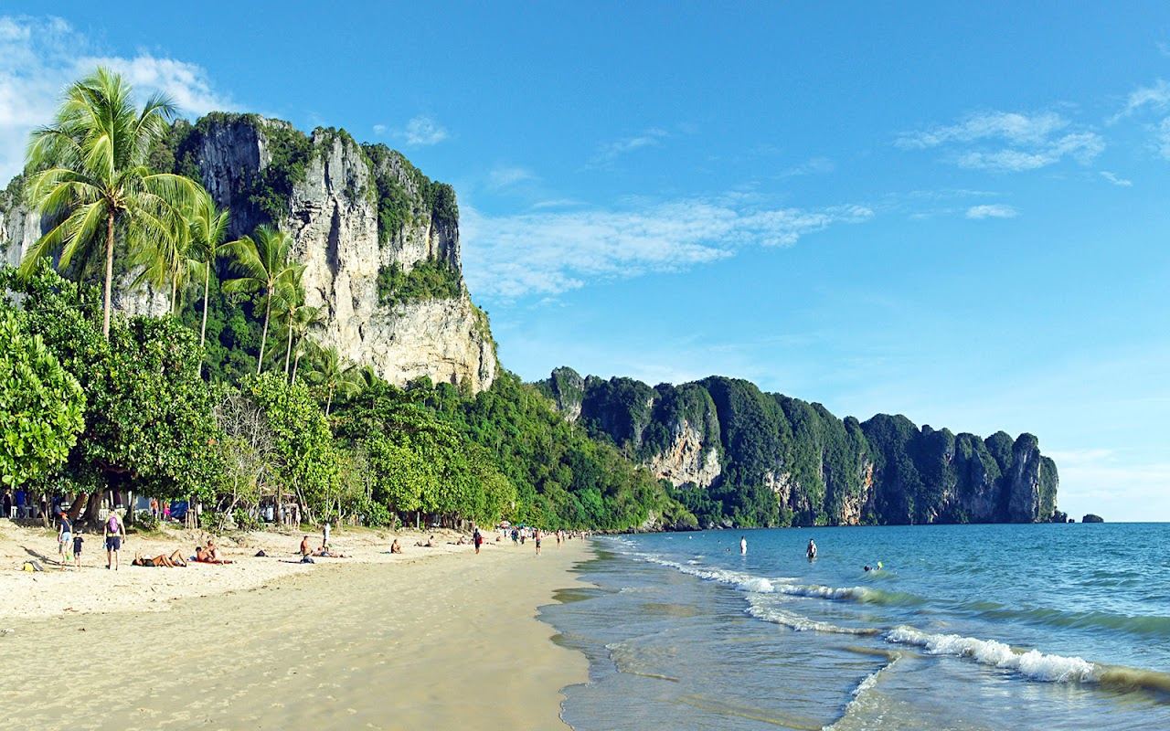 Beach bars and longtail boats along the shore at Ao Nang in Krabi