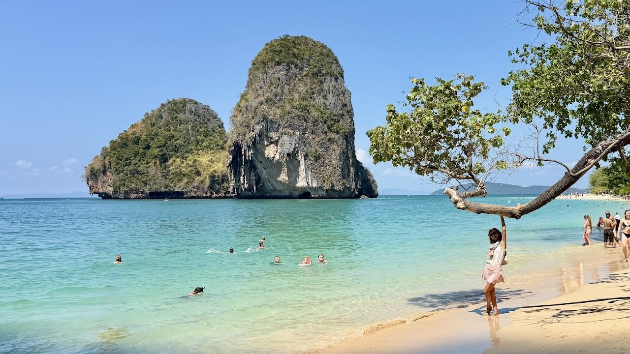 Cliff backed cove and clear water at Phra Nang Cave Beach in Krabi