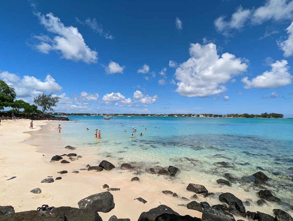 La Cuvette beach in Mauritius, a small sheltered cove of pale sand and calm clear water near Grand Baie