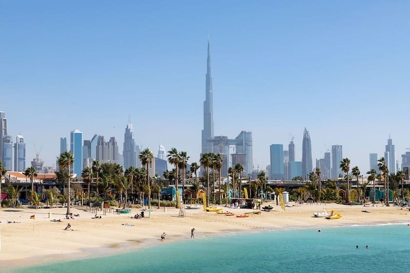 Soft sand and calm Gulf water along the La Mer seafront in Jumeirah Dubai