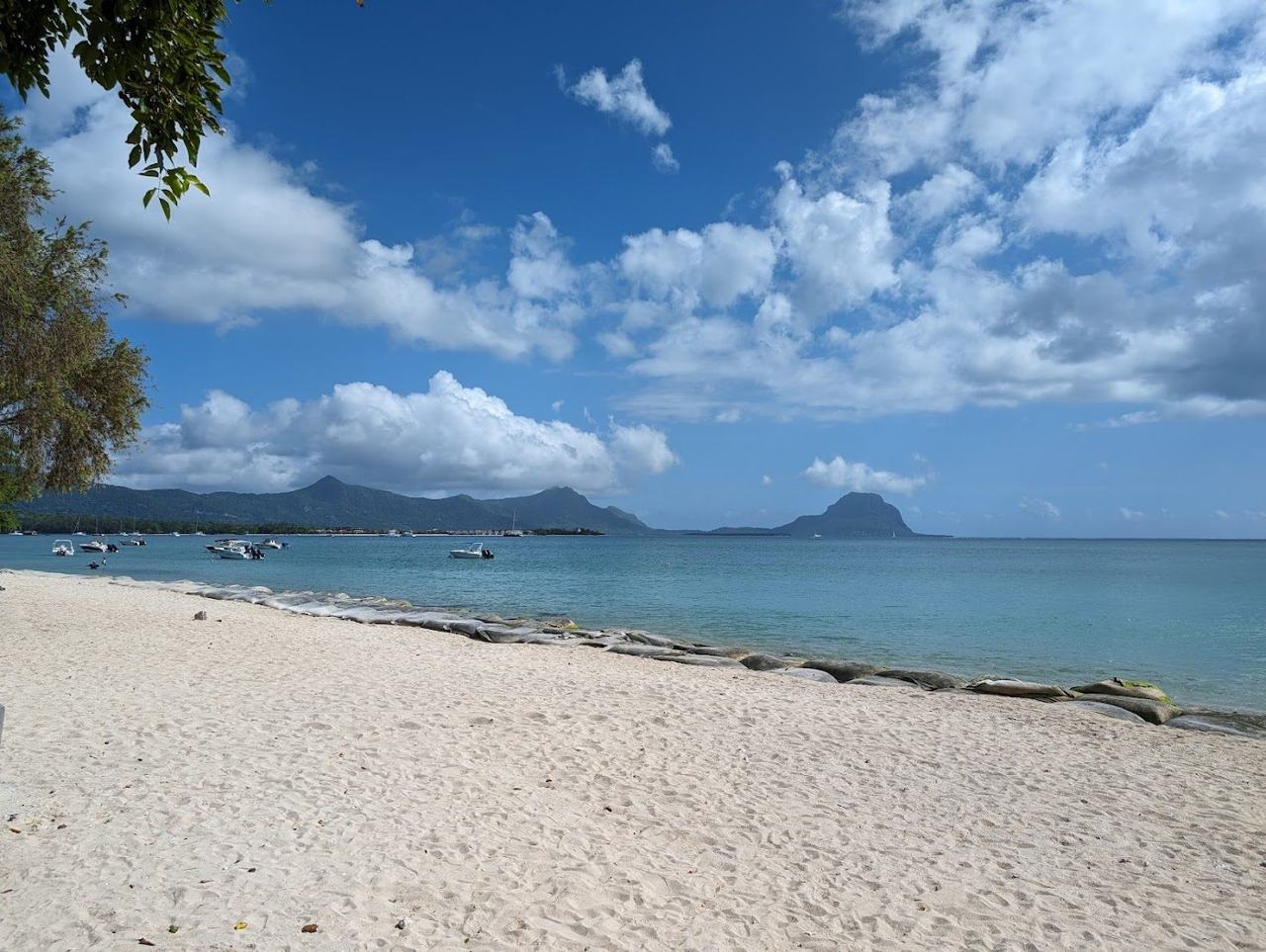 The calm lagoon and mountain backdrop at La Preneuse on the west coast of Mauritius