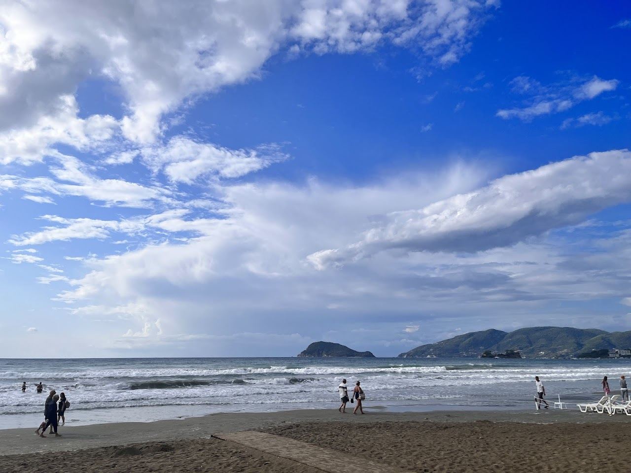 The long shallow golden sand of Laganas beach curving along the marine park bay on the south coast of Zakynthos