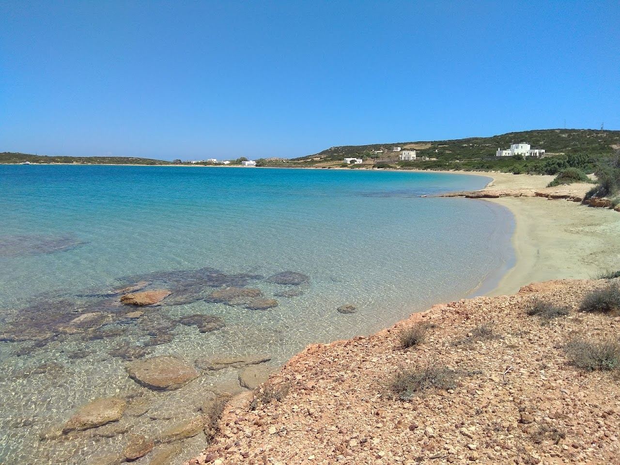 The wide golden sand, dunes and clear water of Lageri beach on the north coast of Paros near Santa Maria