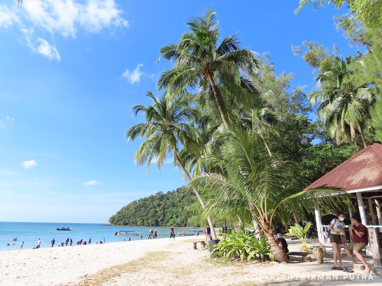 Soft white sand and clear shallow water on the uninhabited island of Pulau Beras Basah off Langkawi
