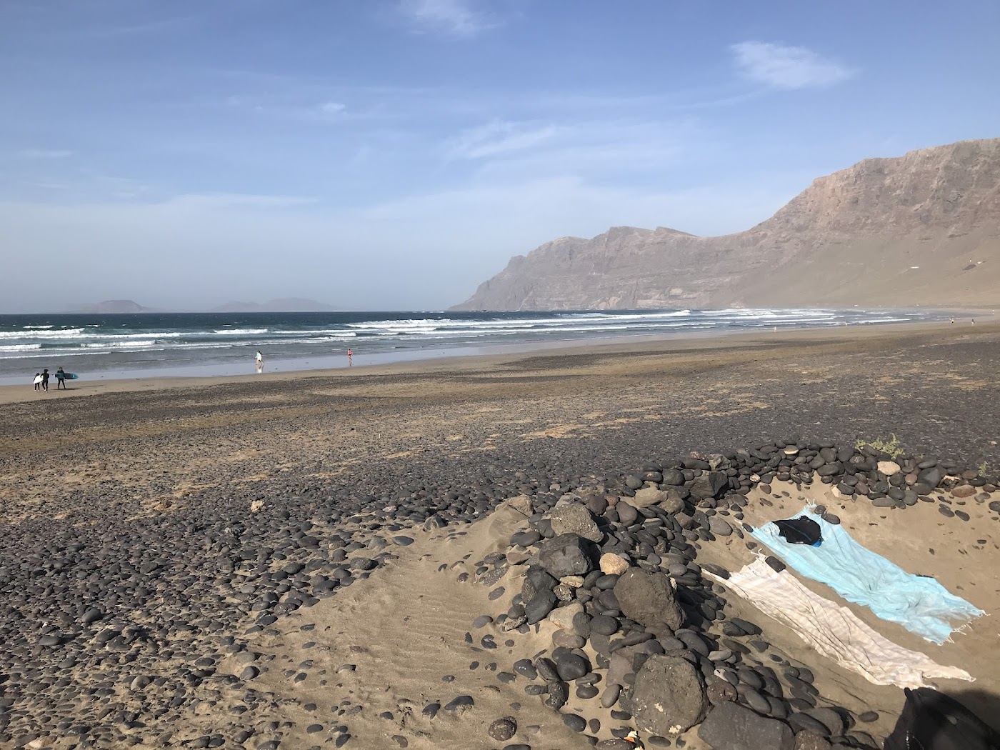 Atlantic sunset over the wide sand of Famara beach below the cliffs in Lanzarote