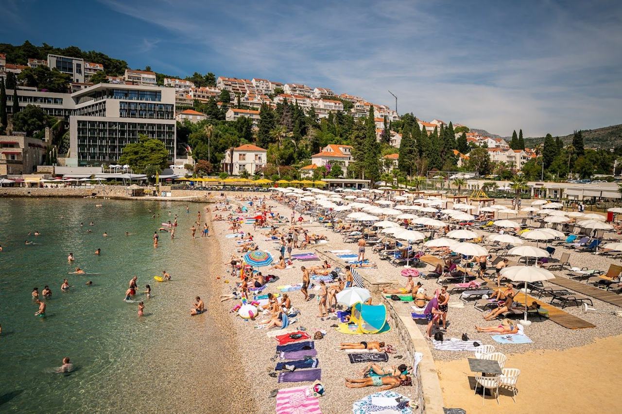 Lapad Beach pebble bay and promenade in Uvala Lapad at Dubrovnik on the Dalmatian Coast