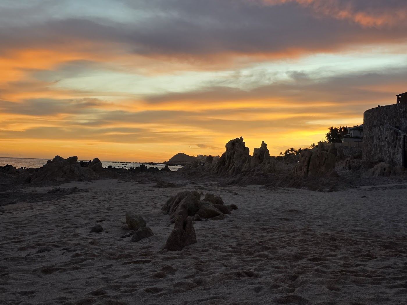 Sandy pockets divided by volcanic rock formations at Playa Las Viudas near Santa Maria in Los Cabos