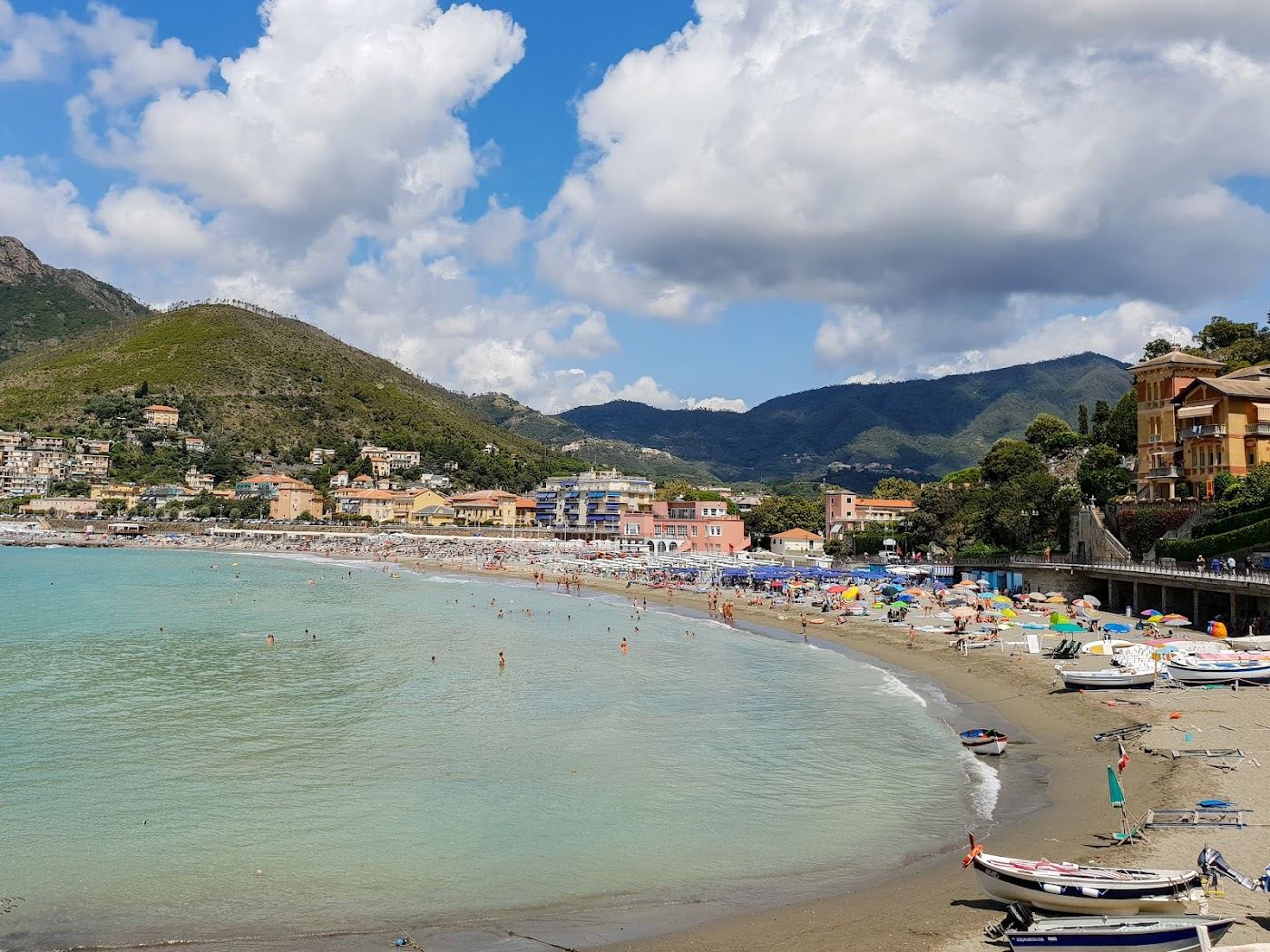 The wide sandy bay of Levanto backed by green hills in Liguria
