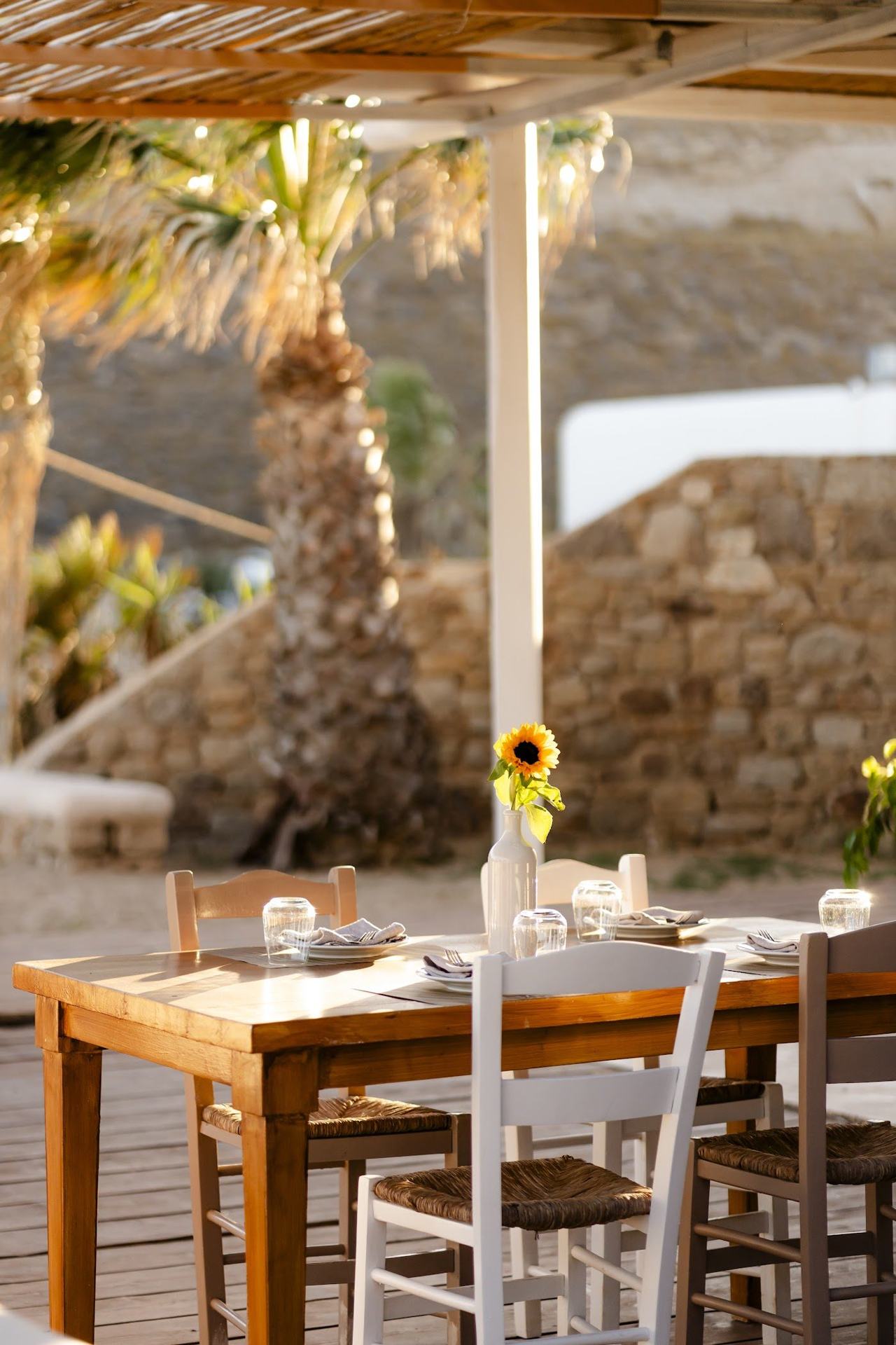 Sunbeds and the calm clear bay at Lia Beach on the southeast coast of Mykonos