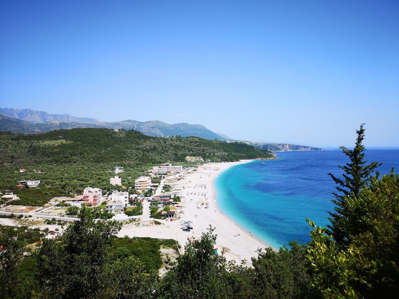 The long pebble bay of Livadhi below Himare on the Albanian Riviera