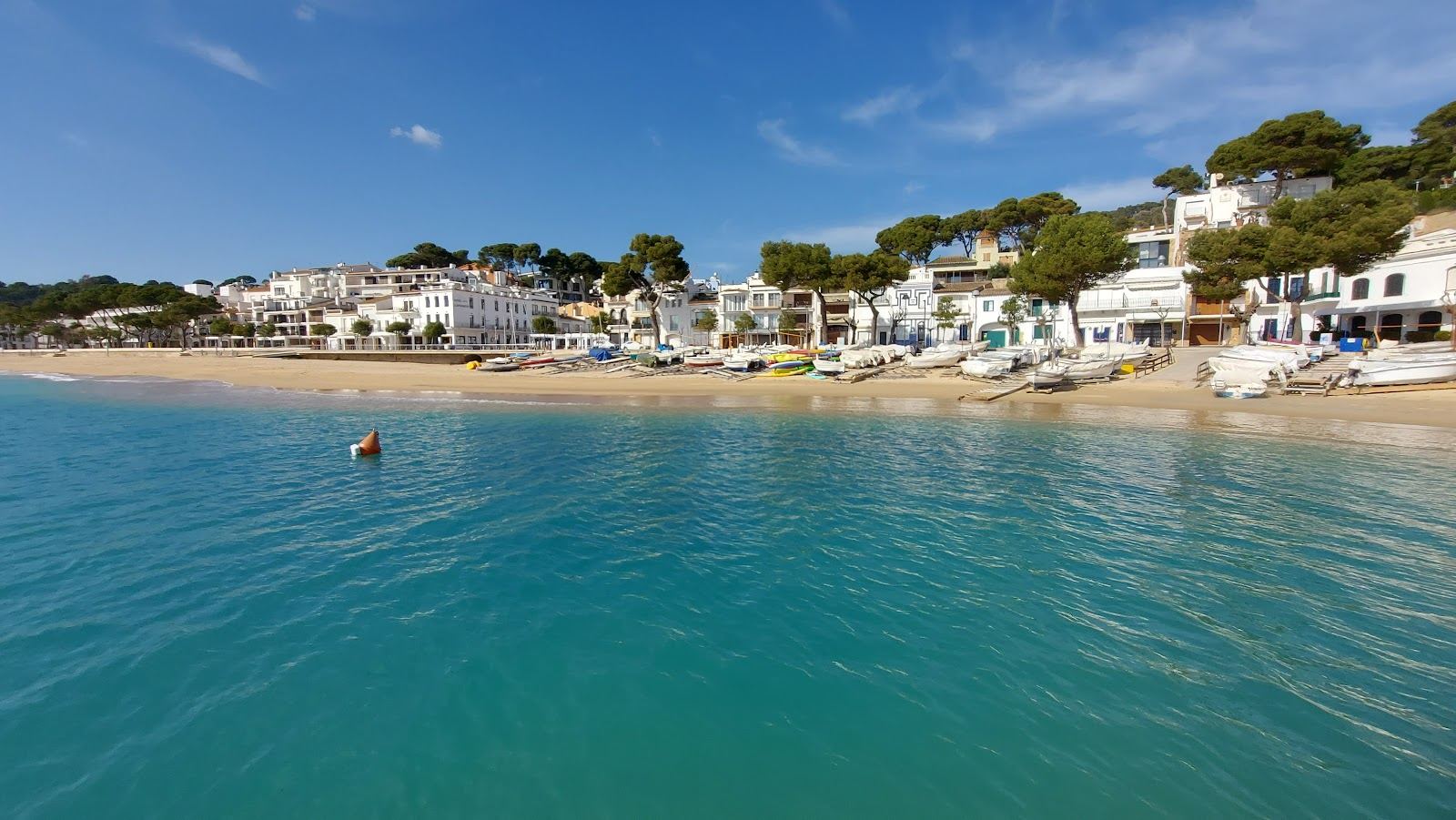 Seafront promenade and moored boats at Llafranc near Palafrugell