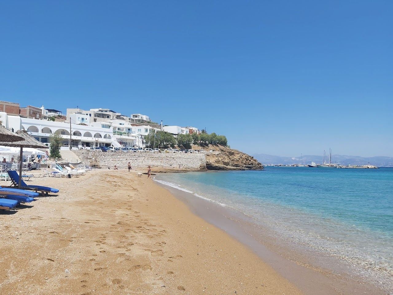 The soft sand and calm shallow water of Logaras bay on the east coast of Paros