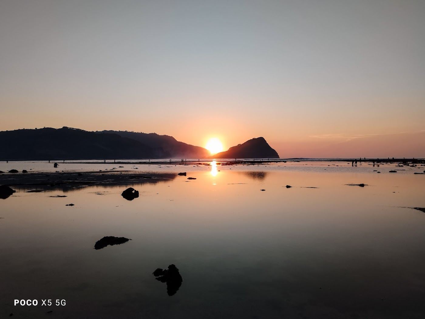 Quiet pale cove and gentle waves at Are Guling on the south coast of Lombok