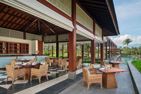 Beachfront pool and gardens at The Sira resort on Sira Beach in north Lombok