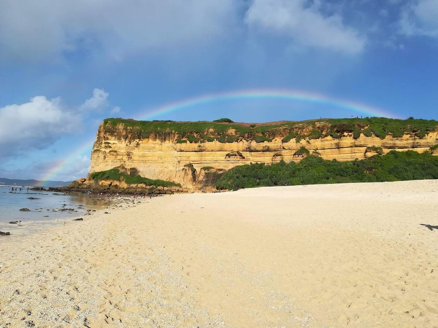 The remote cliff framed cove of white gold sand at Surga Beach in southeast Lombok