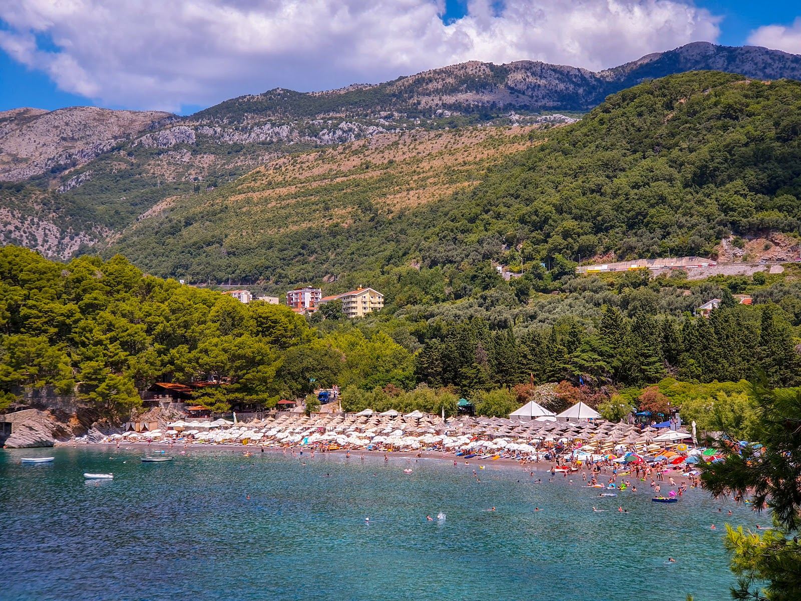 Lucice sheltered horseshoe cove with calm shallow water south of Petrovac in Montenegro