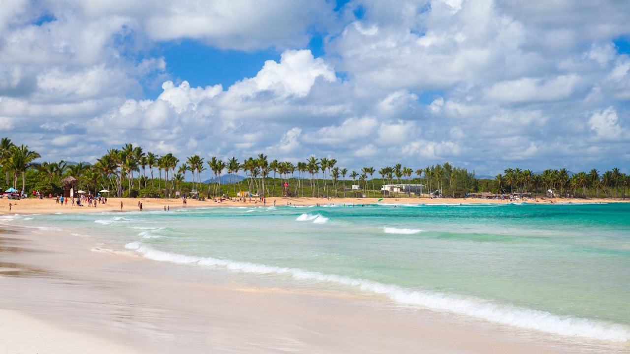 Open Atlantic waves breaking on the wide sand of Playa Macao near Punta Cana