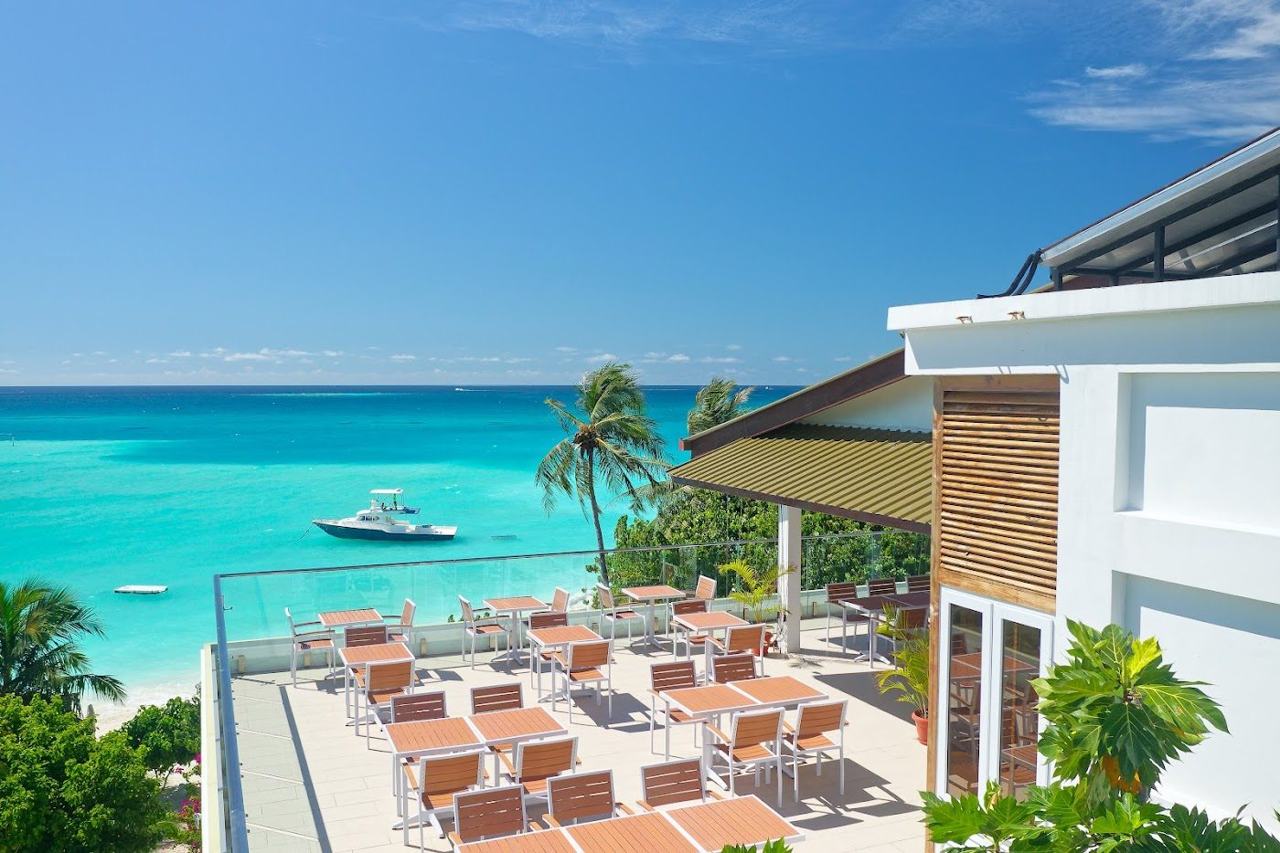 Clear shallow water and a house reef edge off a local island in the Maldives