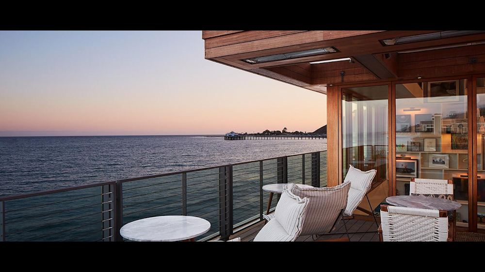 Terrace over the sand at the private Little Beach House Malibu on Carbon Beach