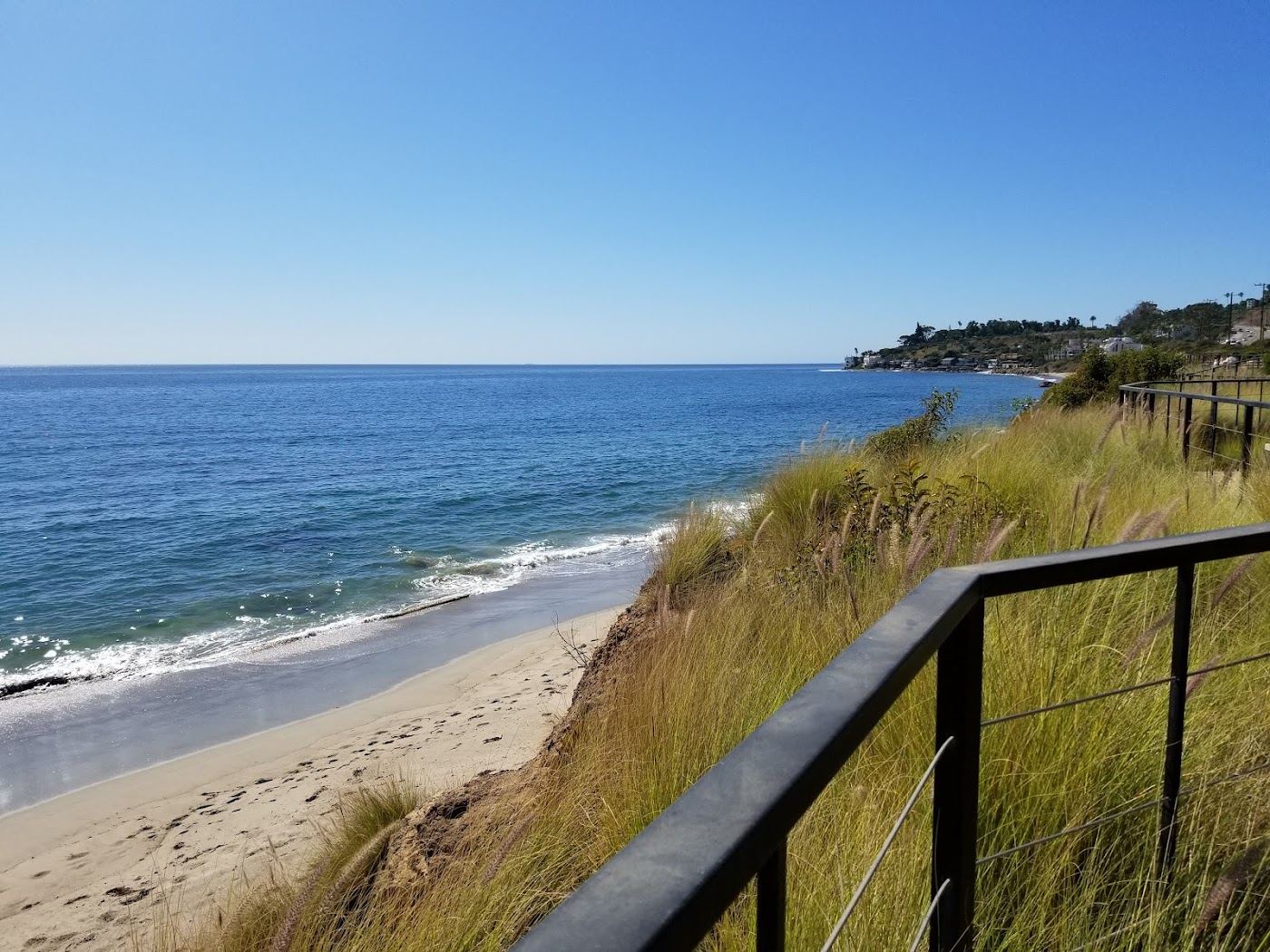 The quiet sand and Pacific surf of Dan Blocker Beach in Malibu